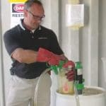 pesticide with red gloves